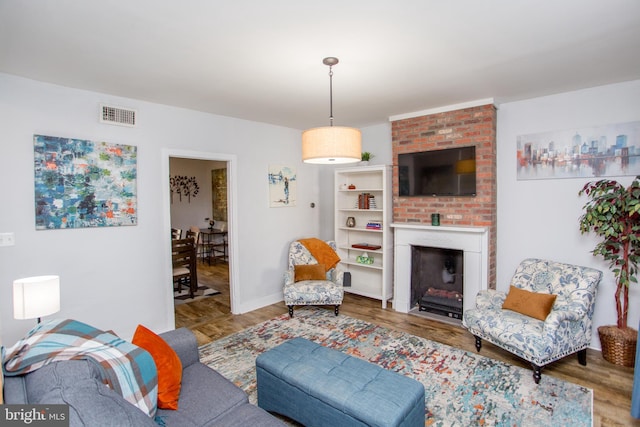 57 N Franklin St, Lambertville, NJ 08530 - living area featuring baseboards, a fireplace, visible vents, and wood finished floors