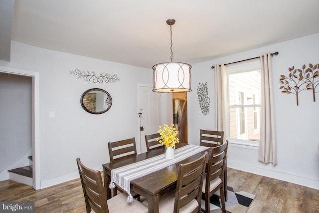 57 N Franklin St, Lambertville, NJ 08530 - dining area with baseboards, stairway, and wood finished floors