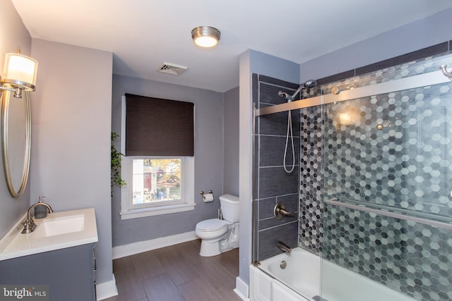 57 N Franklin St, Lambertville, NJ 08530 - full bath featuring toilet, combined bath / shower with glass door, visible vents, baseboards, and vanity