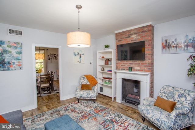 57 N Franklin St, Lambertville, NJ 08530 - interior space featuring a fireplace, baseboards, visible vents, and wood finished floors