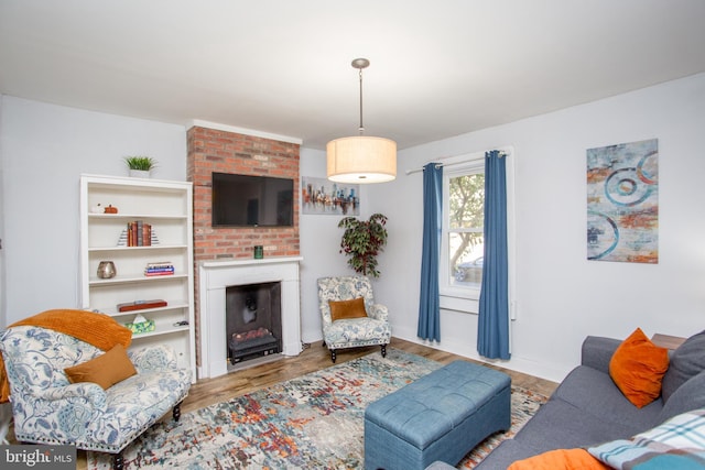 57 N Franklin St, Lambertville, NJ 08530 - living room featuring a brick fireplace, baseboards, and wood finished floors
