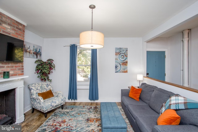 57 N Franklin St, Lambertville, NJ 08530 - living room featuring wood finished floors, baseboards, and a brick fireplace