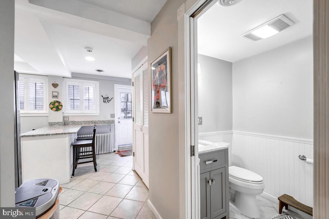 bathroom featuring tile patterned flooring and toilet