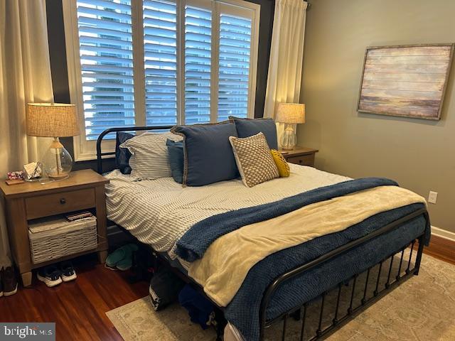 bedroom featuring dark wood-type flooring