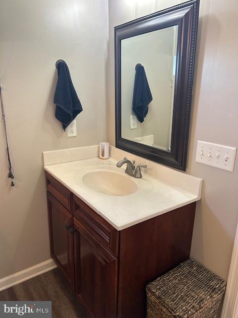 bathroom featuring vanity and wood-type flooring