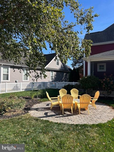 view of patio with a fire pit