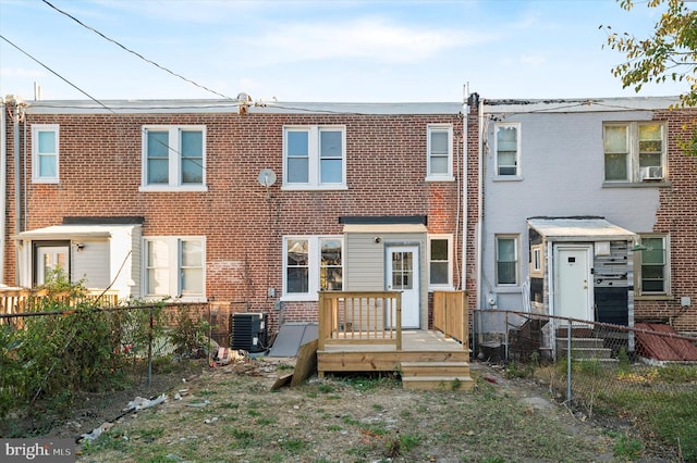 rear view of property featuring central air condition unit