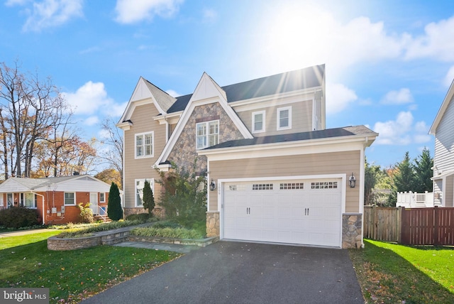 view of front of home featuring a garage and a front yard