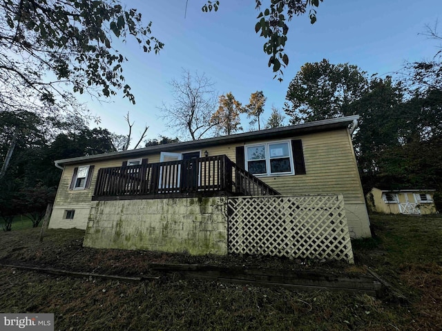 view of front of home with a wooden deck