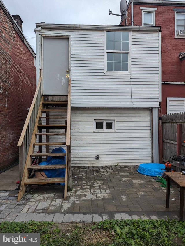 rear view of property featuring a patio area