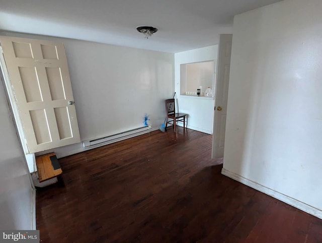 interior space with baseboard heating and dark hardwood / wood-style floors