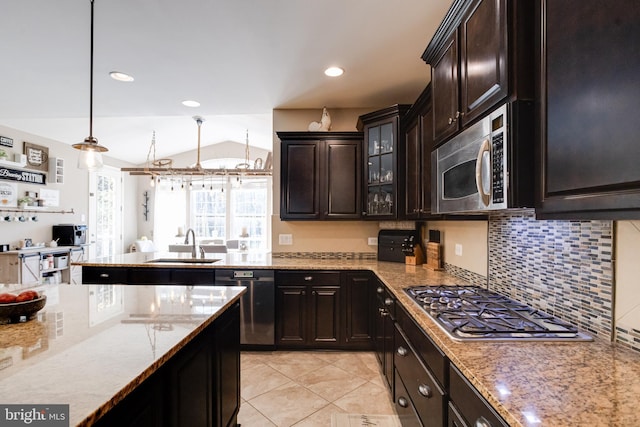 kitchen featuring decorative light fixtures, sink, decorative backsplash, stainless steel appliances, and dark brown cabinets