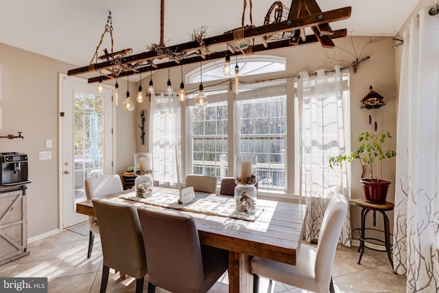 dining space featuring light tile patterned floors