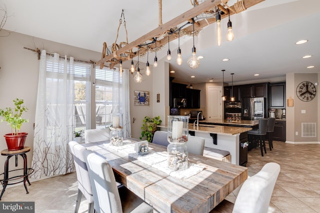 dining room with light tile patterned flooring and sink