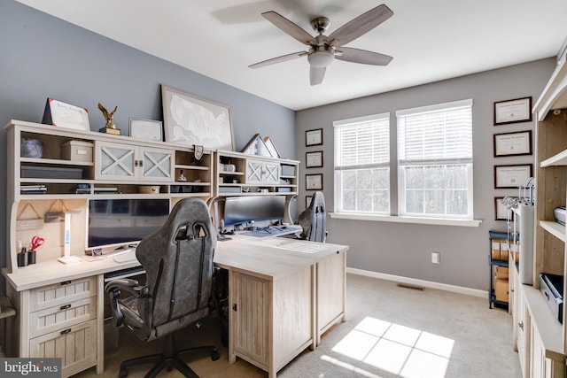 office area with light carpet and ceiling fan