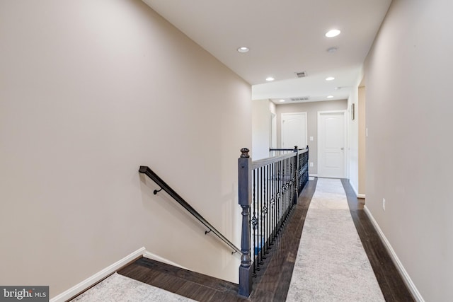 stairs with wood-type flooring