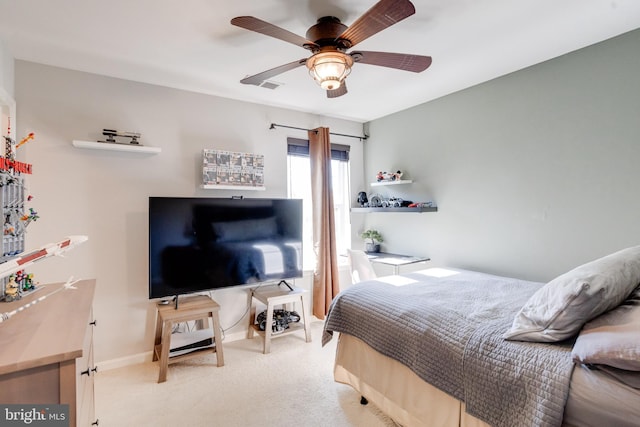 carpeted bedroom with ceiling fan