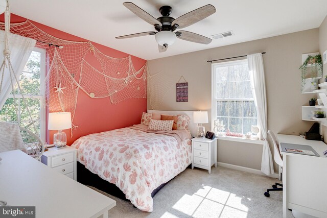 carpeted bedroom with ceiling fan