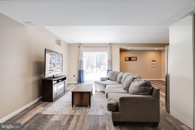 living room featuring dark hardwood / wood-style flooring