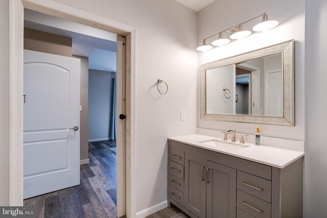 bathroom with vanity and hardwood / wood-style floors