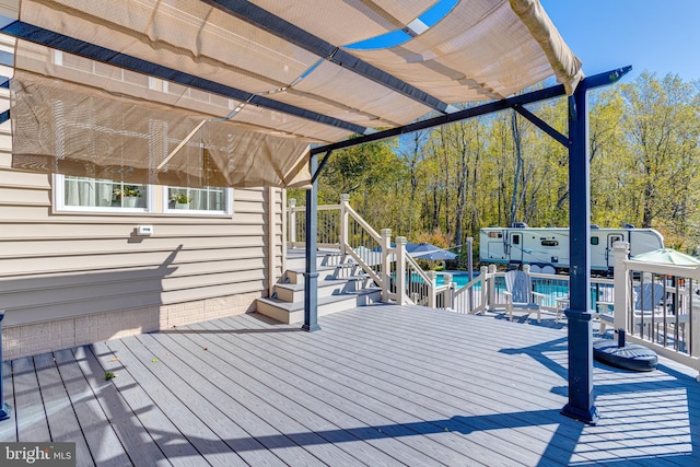 wooden deck featuring a pergola