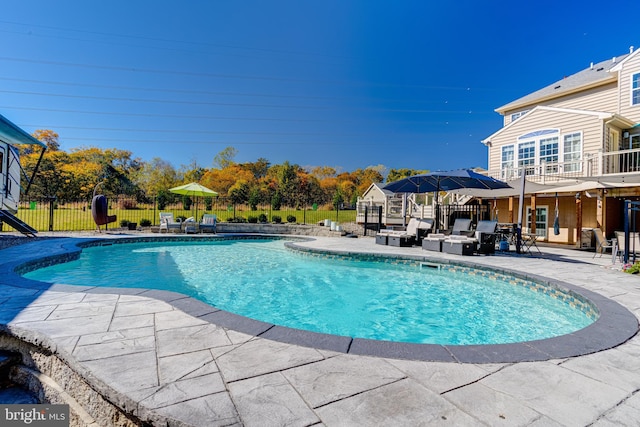 view of pool with an outdoor hangout area and a patio area