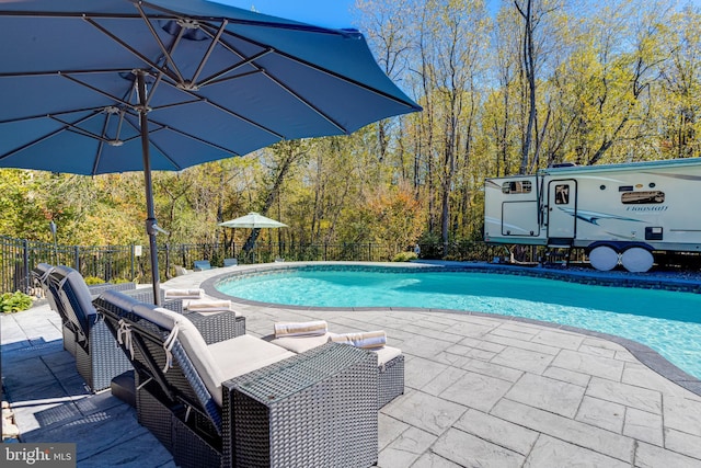 view of swimming pool featuring a patio