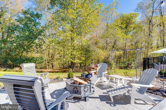 view of patio / terrace with an outdoor fire pit