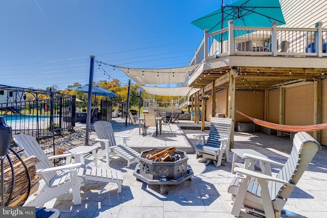 view of patio / terrace with an outdoor fire pit