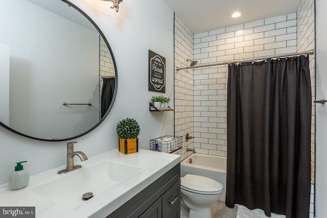 full bathroom featuring vanity, toilet, and shower / bathtub combination with curtain