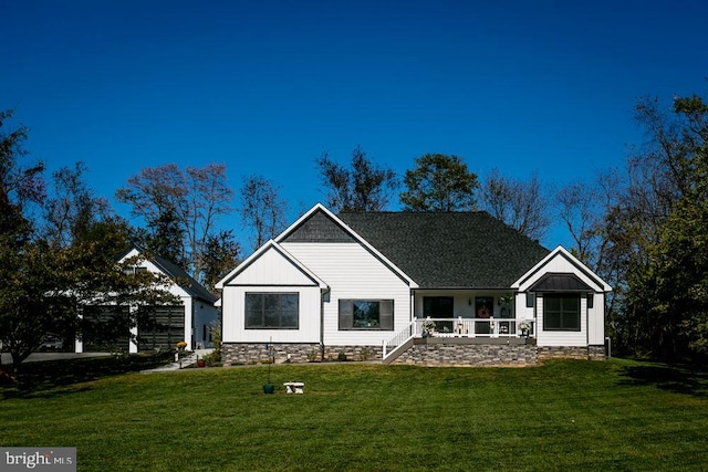 view of front of house featuring a front yard and covered porch