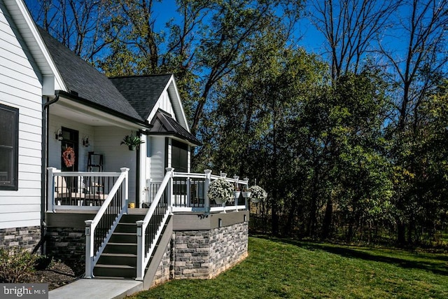 view of side of home featuring a yard