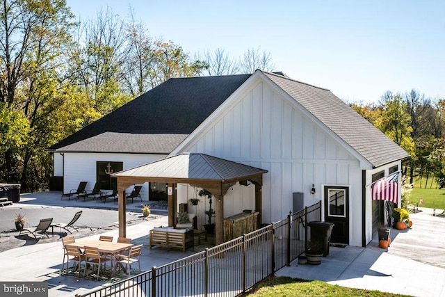 exterior space featuring a gazebo, outdoor lounge area, and a patio