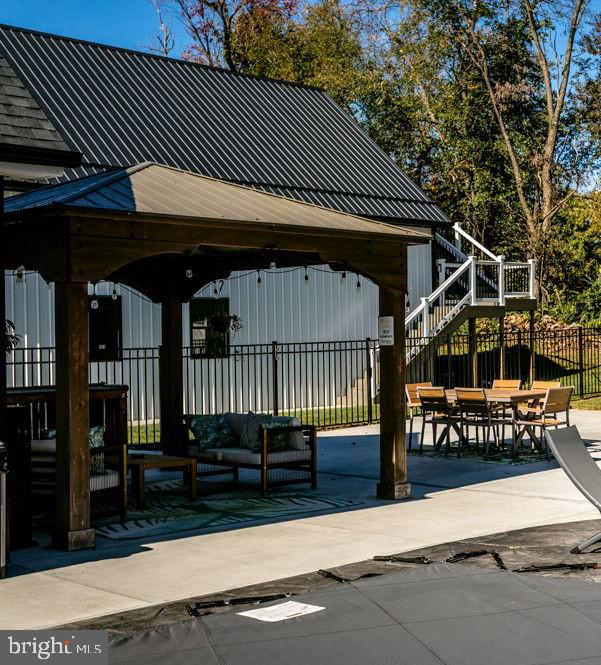 surrounding community with a gazebo and a patio area