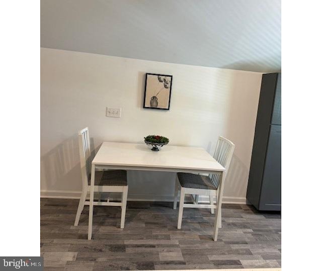 dining space featuring dark hardwood / wood-style floors