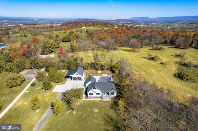 birds eye view of property featuring a mountain view