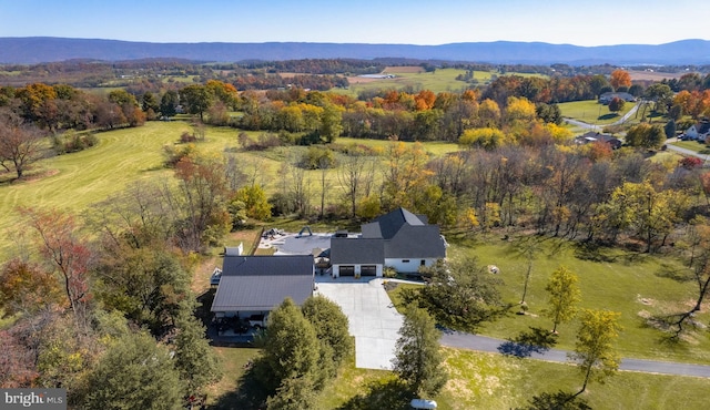 drone / aerial view featuring a mountain view