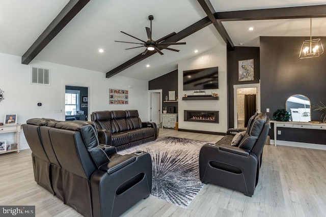 living room featuring beamed ceiling, ceiling fan with notable chandelier, high vaulted ceiling, and light hardwood / wood-style floors