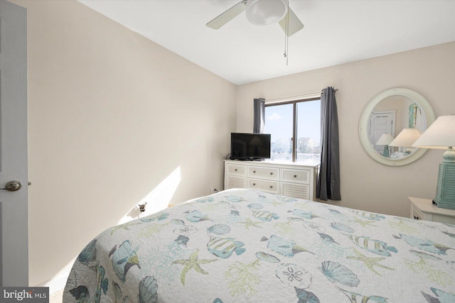 bedroom featuring lofted ceiling and ceiling fan