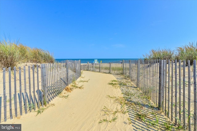 view of water feature with a beach view