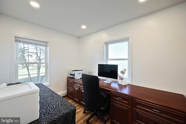 office area with light wood-type flooring and baseboard heating