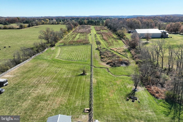 birds eye view of property with a rural view