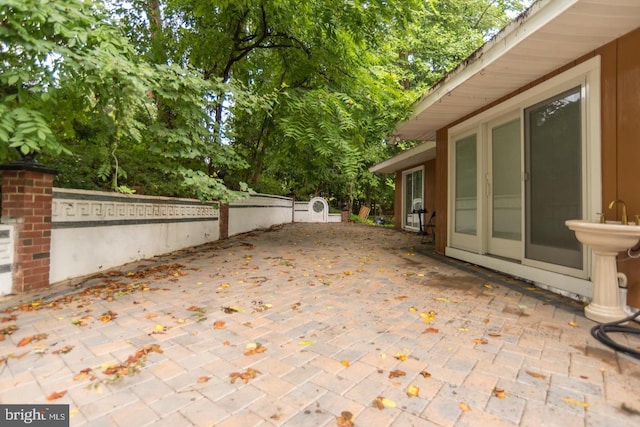 view of patio / terrace featuring fence