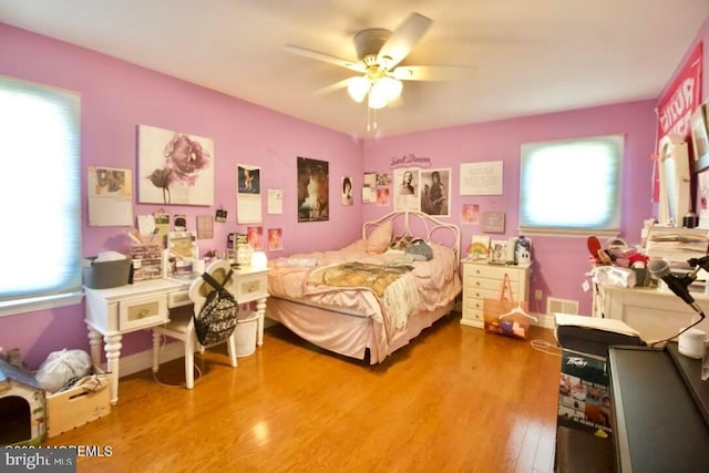 bedroom featuring hardwood / wood-style flooring and ceiling fan