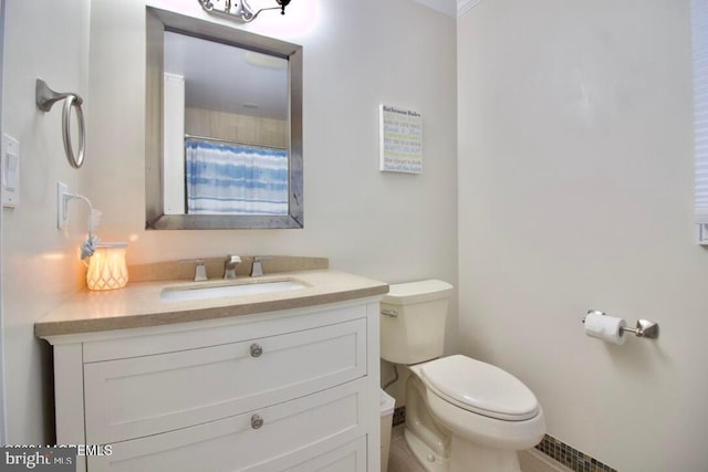 bathroom featuring vanity, a shower with curtain, and toilet