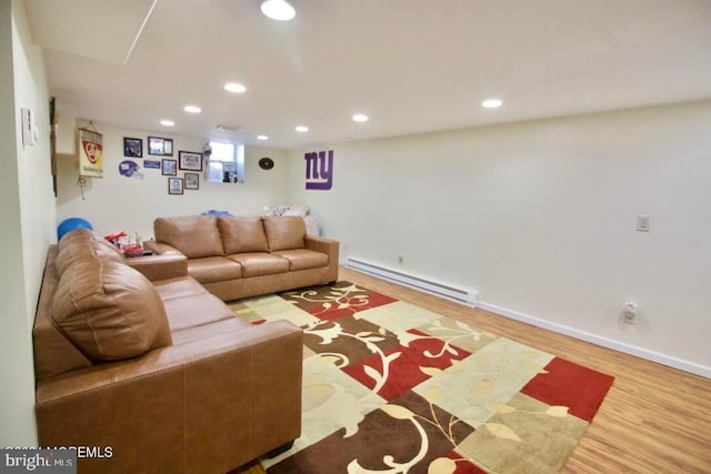 living room with a baseboard radiator and hardwood / wood-style floors