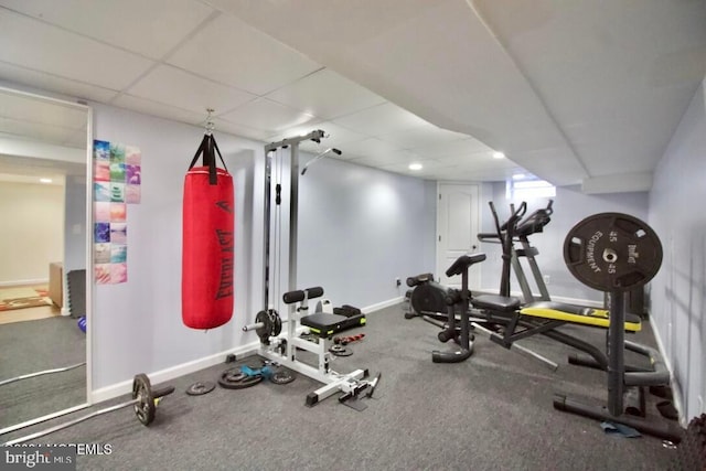 exercise area featuring a paneled ceiling