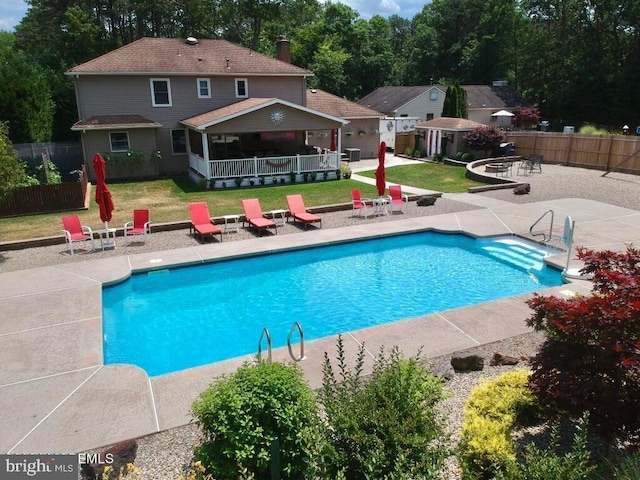 144 Sams Rd, Jackson, NJ 08527 - view of pool with a fenced in pool, an outbuilding, fence, a yard, and a patio area