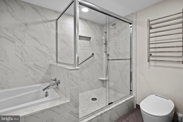 bathroom with radiator heating unit, shower with separate bathtub, and toilet