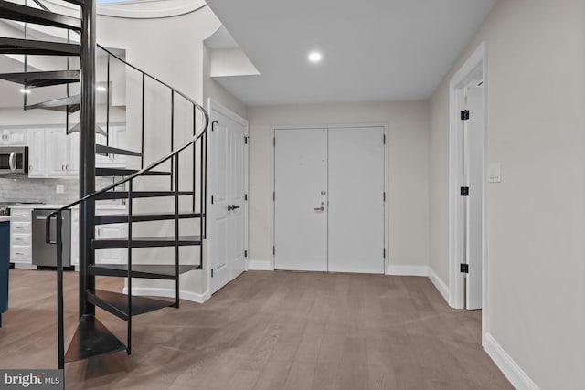 entrance foyer with light hardwood / wood-style floors